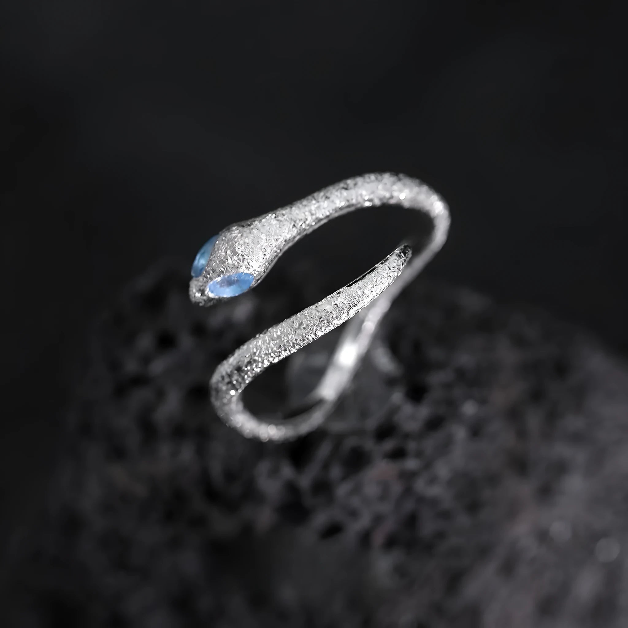Silver adjustable snake ring with electroplated platinum finish and detailed zodiac design