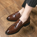 Men's black slip-on business casual shoes with tassel detail and rubber sole