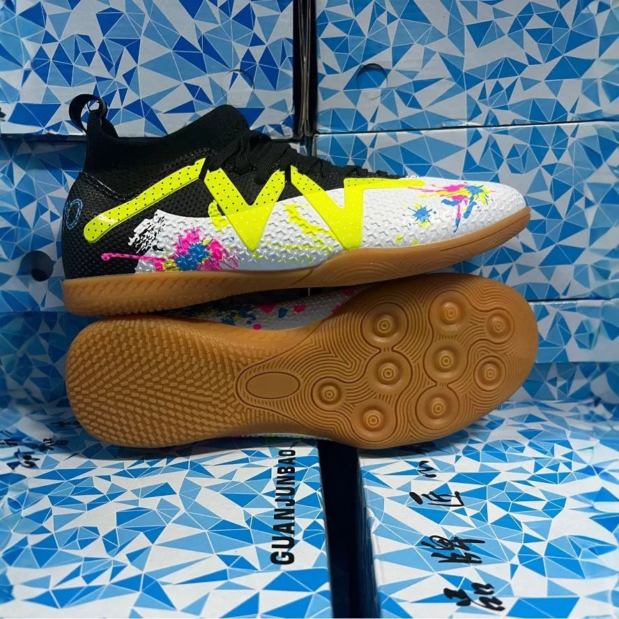 Low-top adult football boots with replaceable screw-in studs on a non-slip rubber sole.