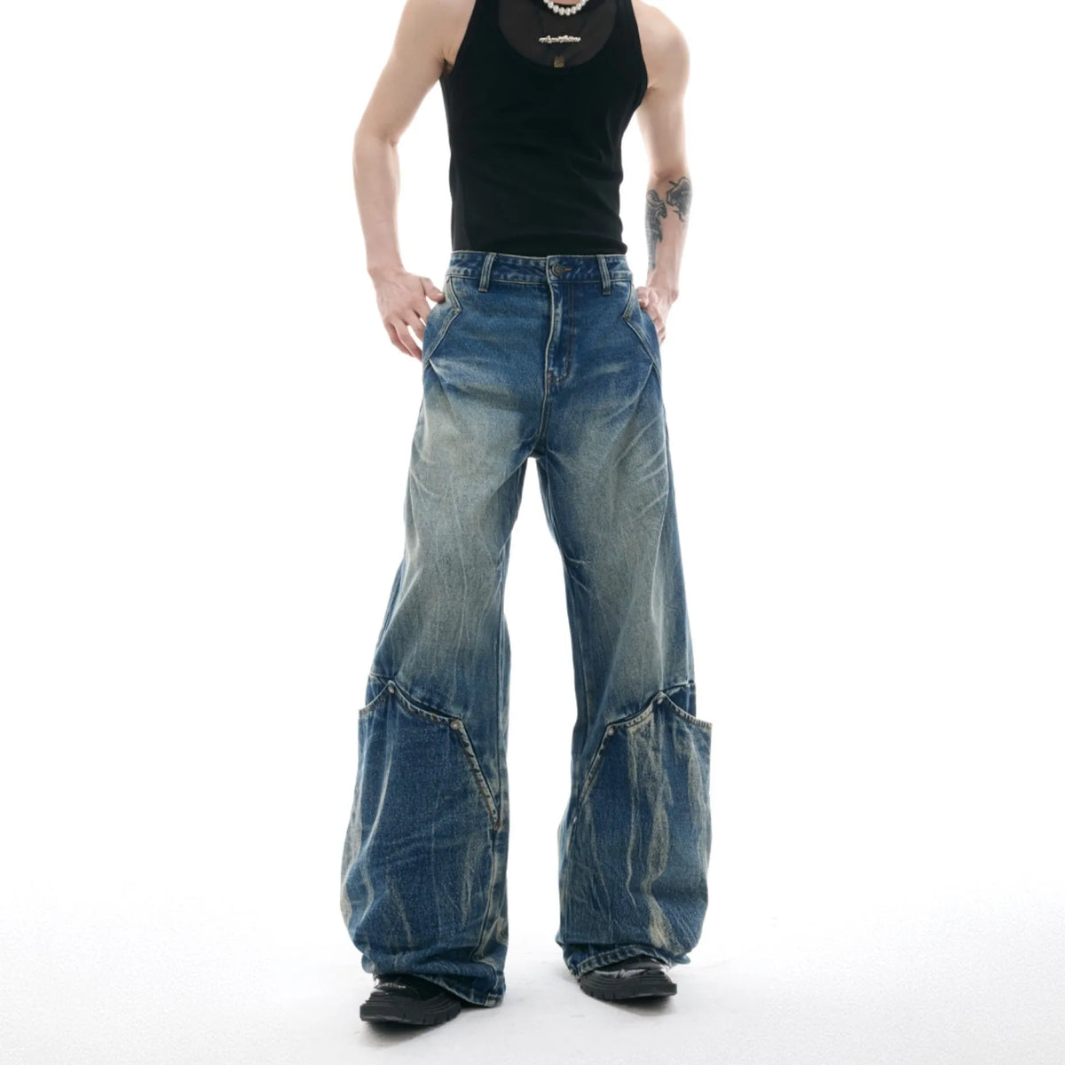 Men's Verdant Blue loose fit jeans with retro washed burst pattern and curved knife design