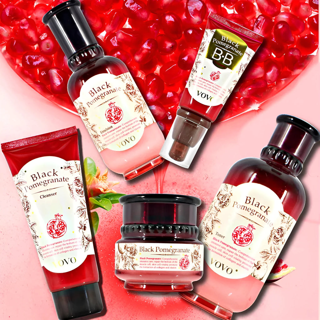 Pomegranate skincare set with cleanser, toner, essence, milk, cream, and eye cream bottles.