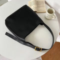 Women's soft PU shoulder bag with swing threads decoration in black and brown colour options