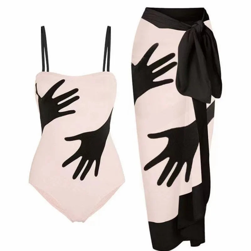 Women's one-piece bikini swimsuit with an attached white tulle skirt, shown on a mannequin.