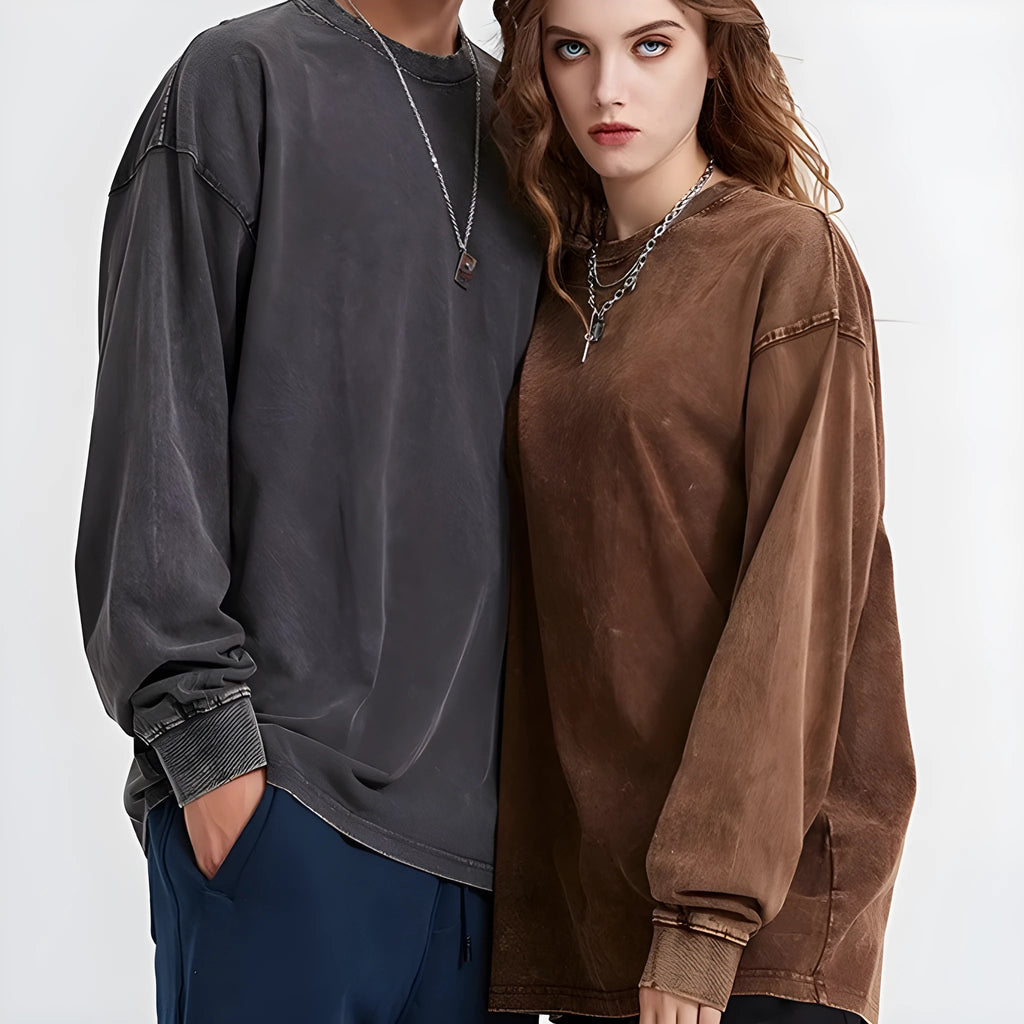 Man wearing a washed vintage grey batik cotton pullover with a loose fit and long sleeves.