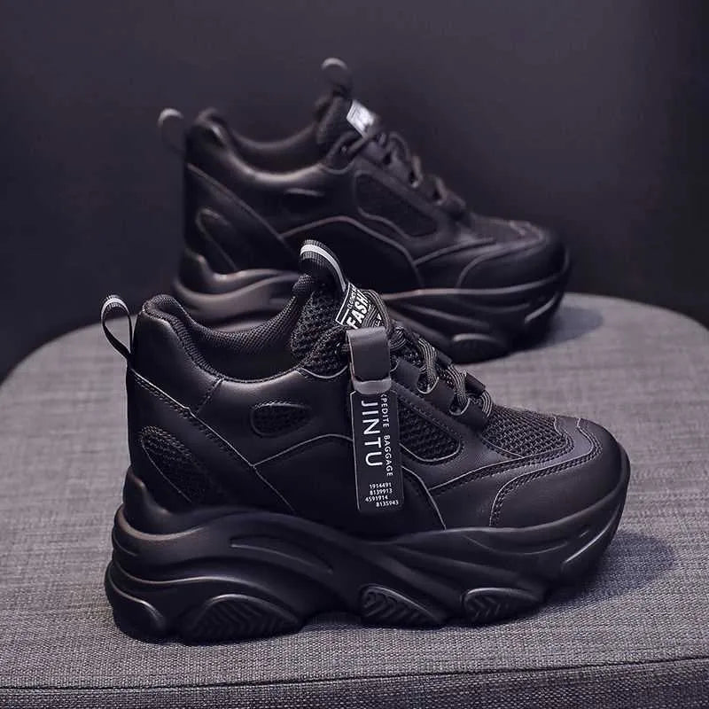 Women's black mesh platform casual shoes with a hollow-out toe holder design on a white background.