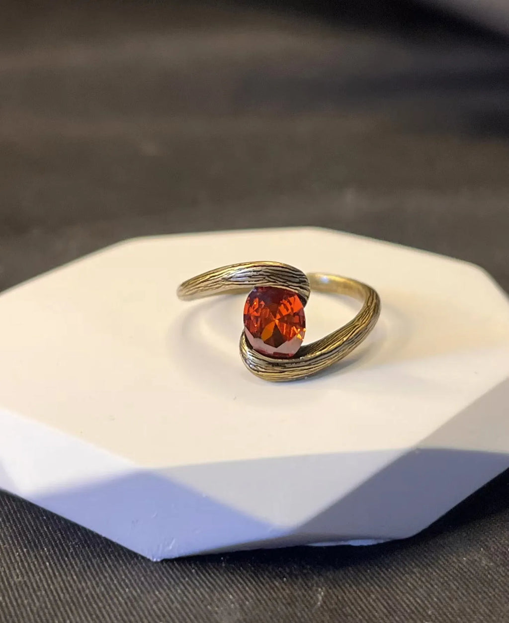 Copper adjustable ring with brushed finish and diamond coloured gem in retro heart shape