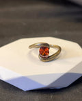 Copper adjustable ring with brushed finish and diamond coloured gem in retro heart shape