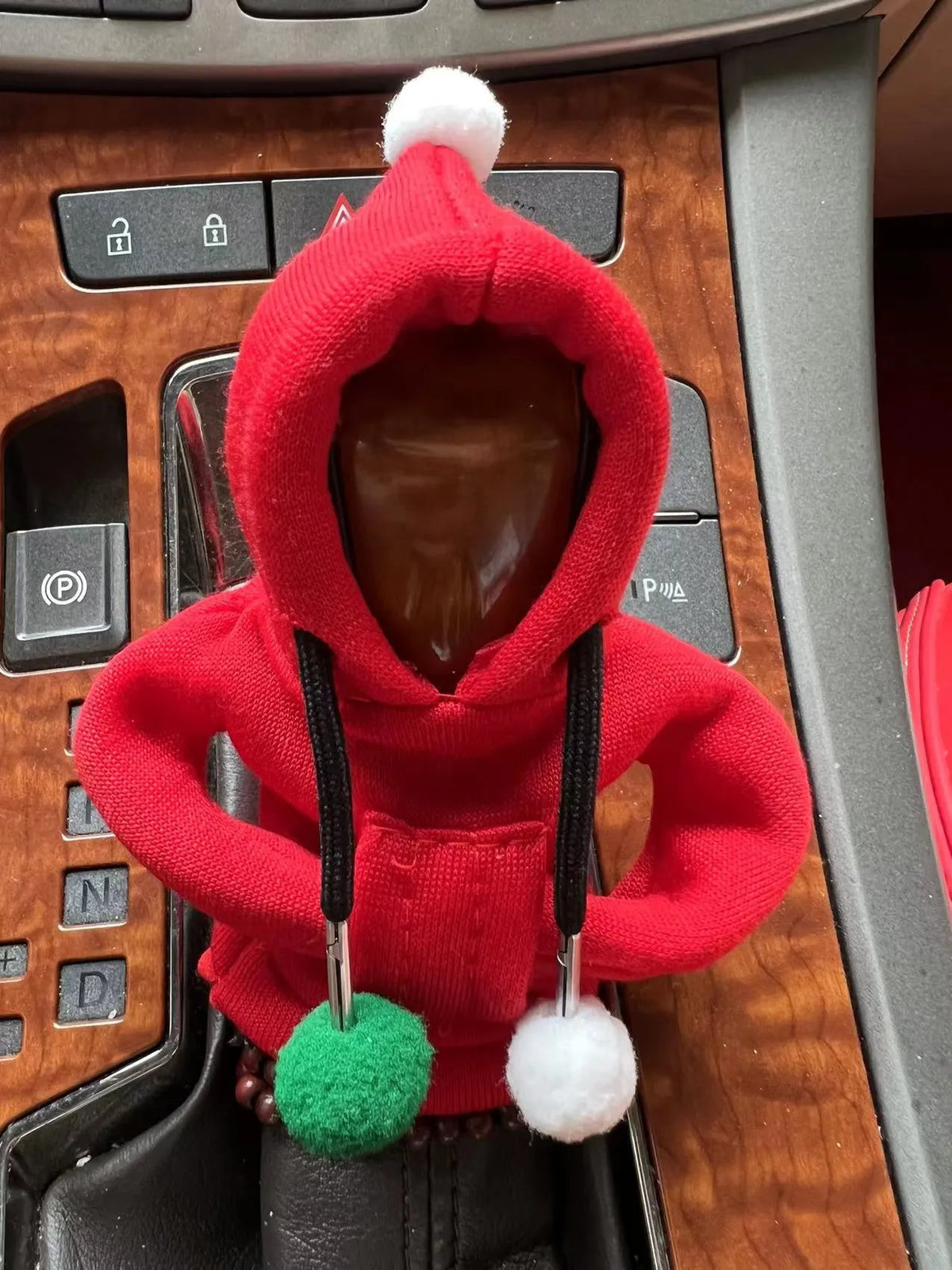 Santa Claus car gear lever cover in black or pink fabric with hooded sweatshirt design, fitting gear shift knob and handbrake.