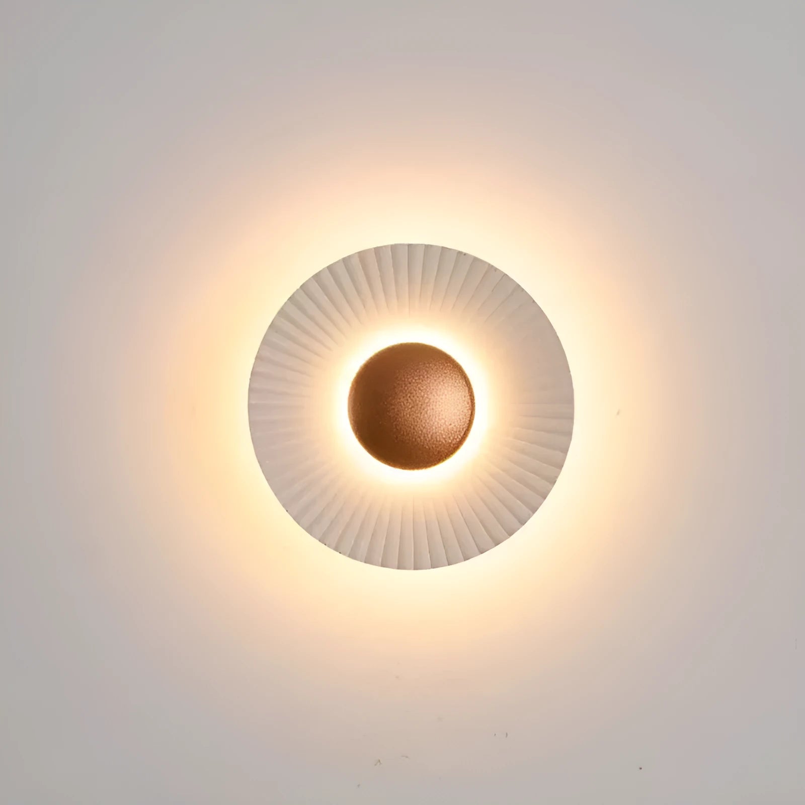 Round aluminium wall lamp mounted on a wall, showing LED illumination.