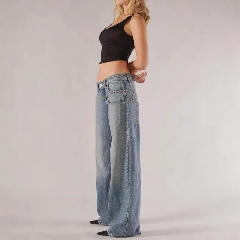 Blue loose straight wide leg cotton trousers with low waist and splicing detail on a hanger.