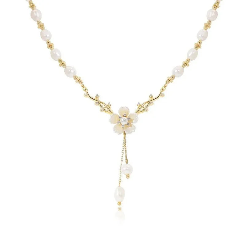 Women's alloy necklace with flower pearl pendant and floral decorative elements