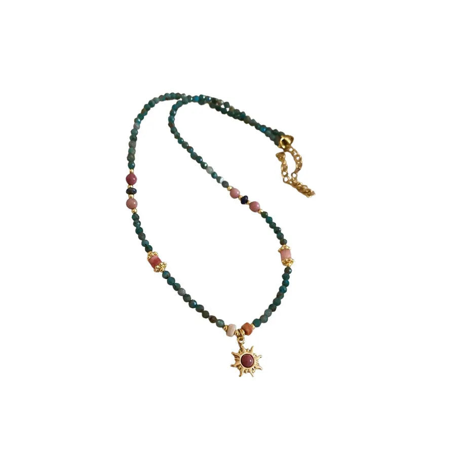 Freshwater pearl necklace with stone sun pendant in blue-sun colour option, court style geometric design