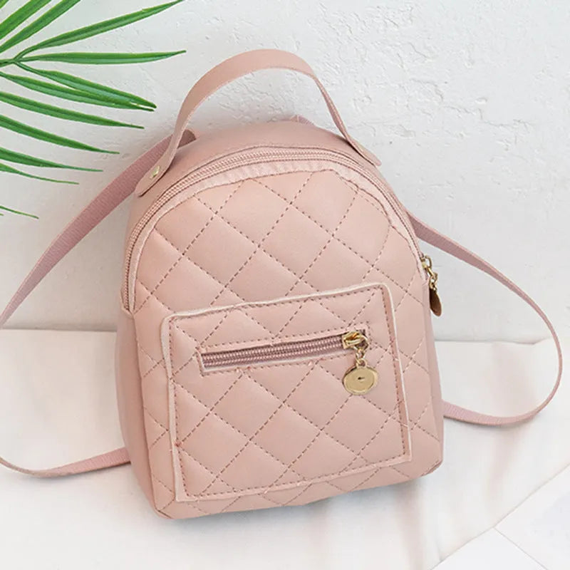 Girls square hard PU backpack with embroidery detail in black, pink or white, showing soft handle and outer pocket.