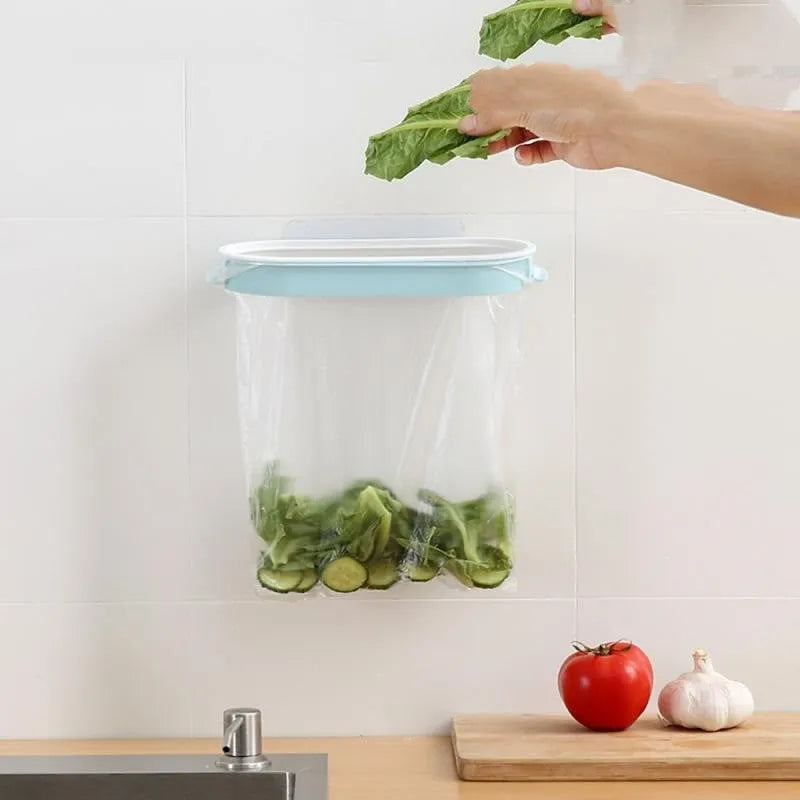 Blue plastic kitchen garbage bag storage rack mounted inside cabinet door