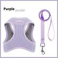 Brown cloth dog harness with an adjustable chest strap and a separate hand-held rope.