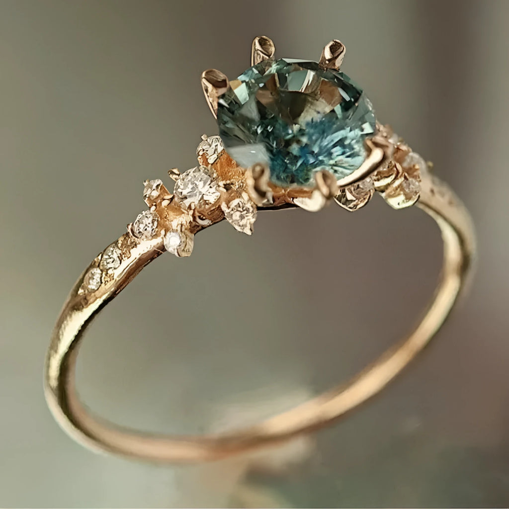 Gold-coloured geometric claw ring with a chamfered square design and a set zircon stone.