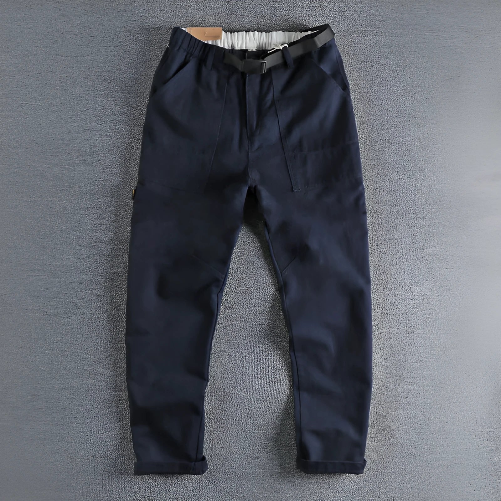 Men's khaki cotton work trousers featuring a buckle belt closure and a three-dimensional cut.