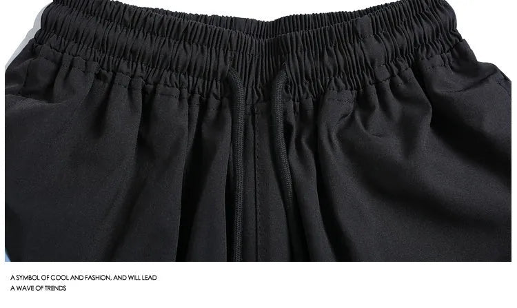Men's black quick-drying sports shorts with elastic waist and straight-leg design for training