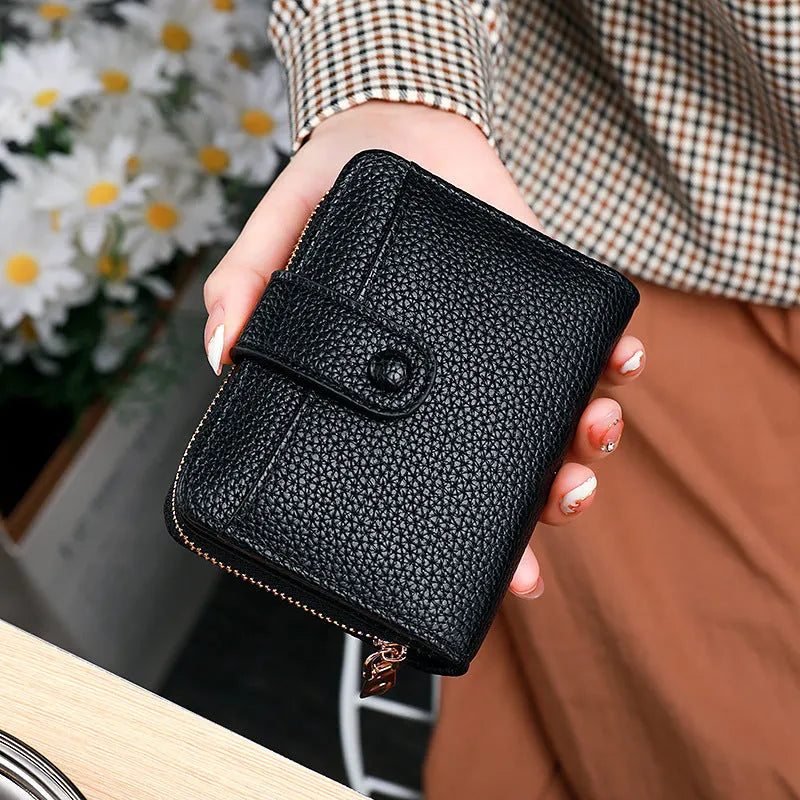 Women's short wallet in PU with lychee pattern, shown in beige, pink, black, and red colour options.