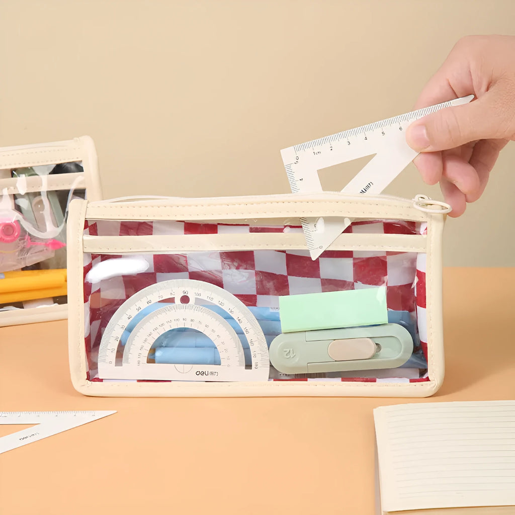 Transparent PVC pencil case with chessboard grid pattern showing pens inside, dimensions 21.5cm x 8cm x 11.5cm