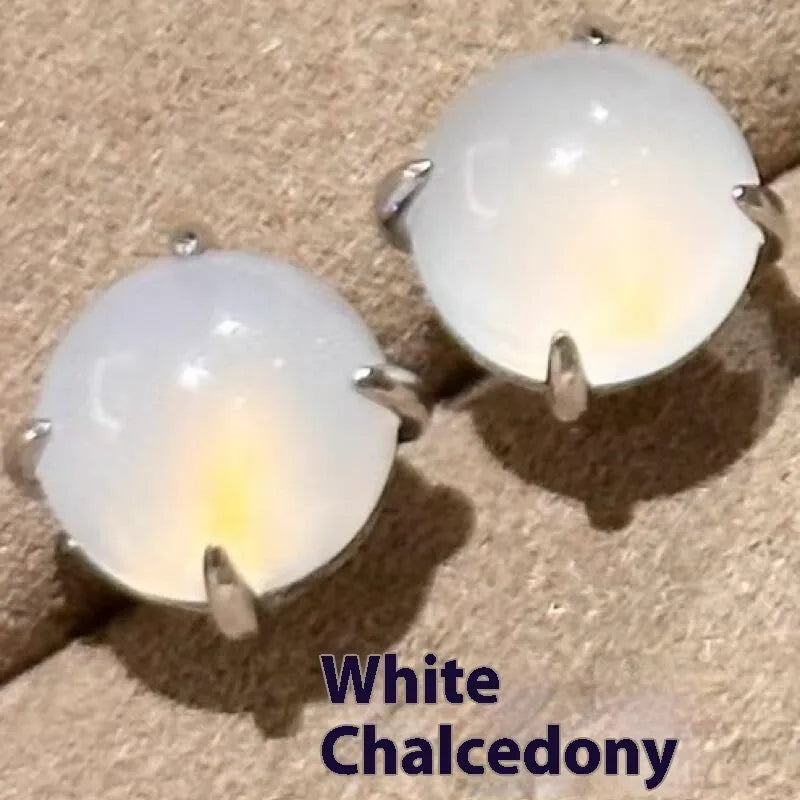 A pair of Chinese-style retro stud earrings with a round egg-shaped chalcedony stone in a four-claw copper setting.