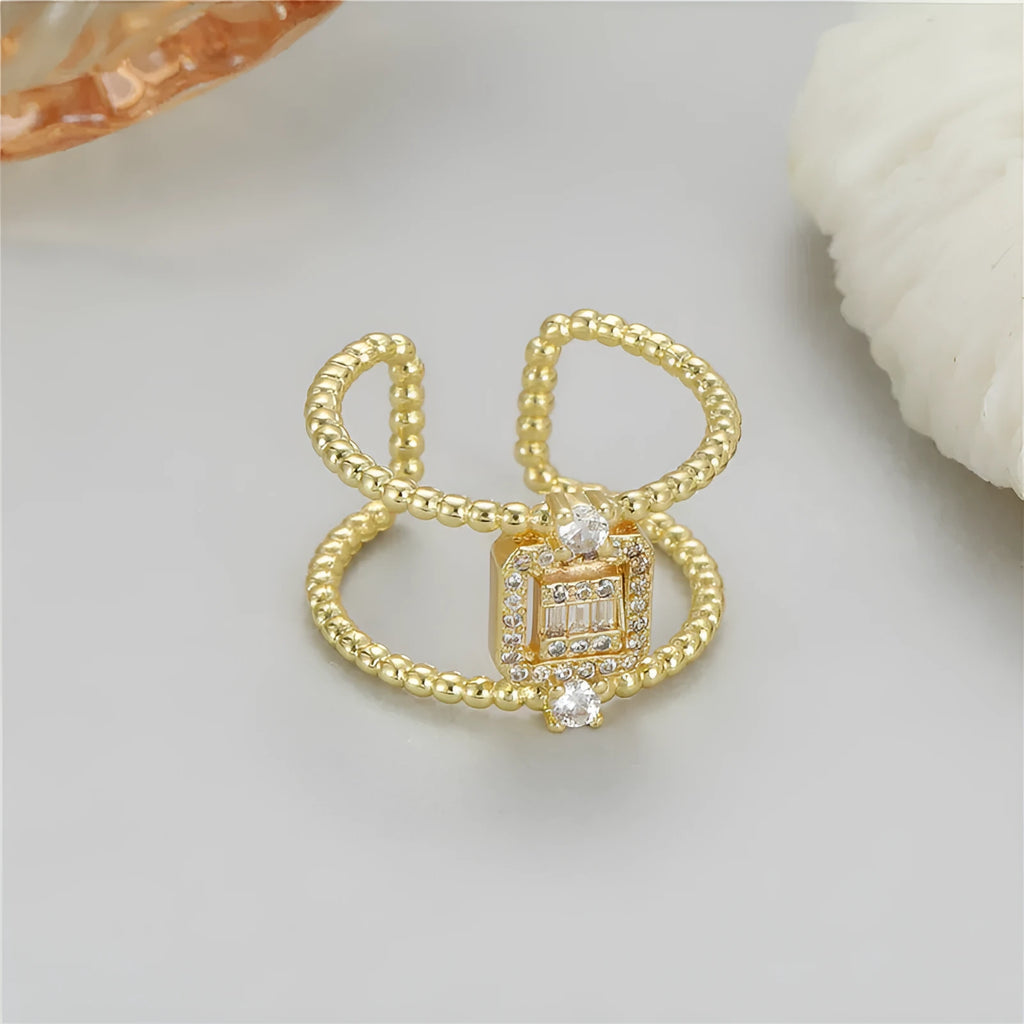 Adjustable copper open ring with asymmetrical U-shape in gold tone colour H-12813.