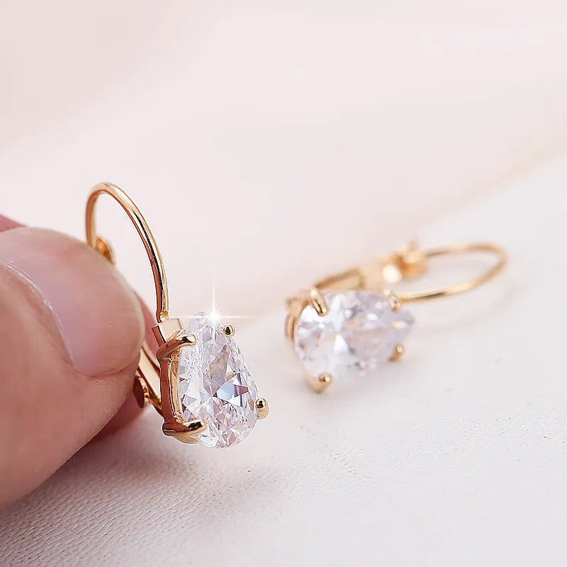 Women's drop-shaped copper earrings with metal inlays in gold and platinum colour options