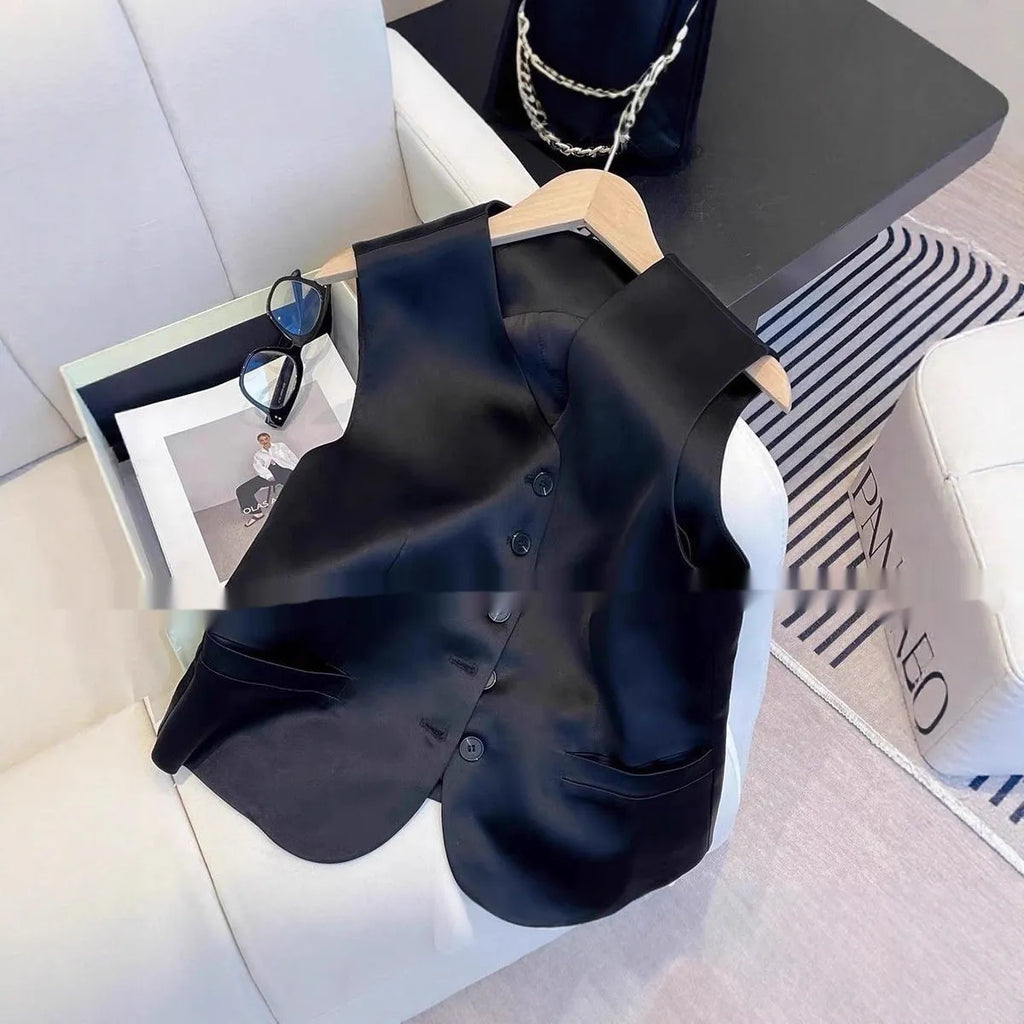 Black satin ladies vest with loose fit and sleeveless design