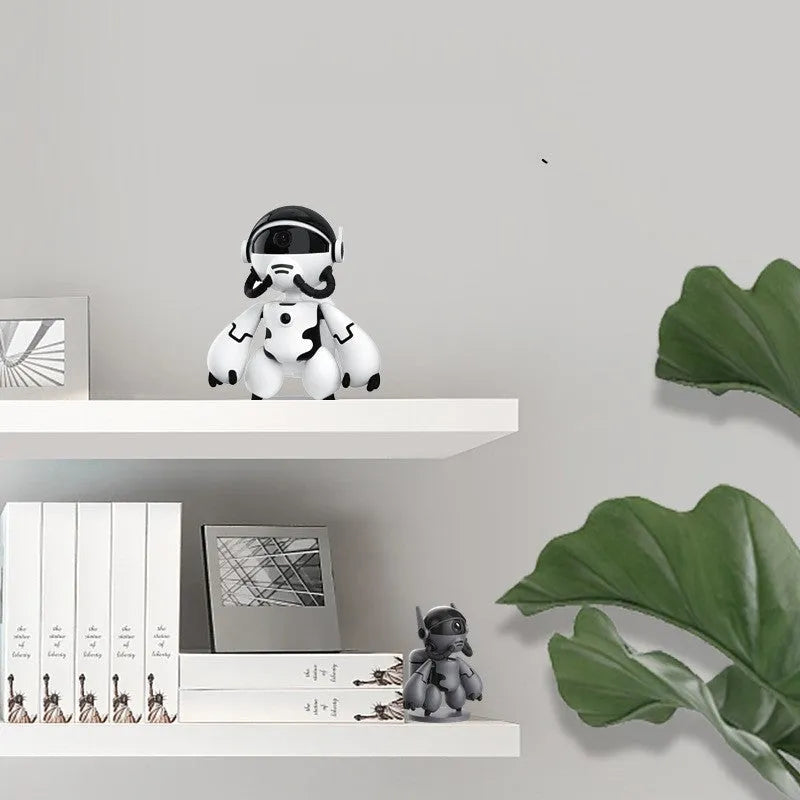 White or black compact home security camera on a detachable base, showing 1080P HD and battery operation.
