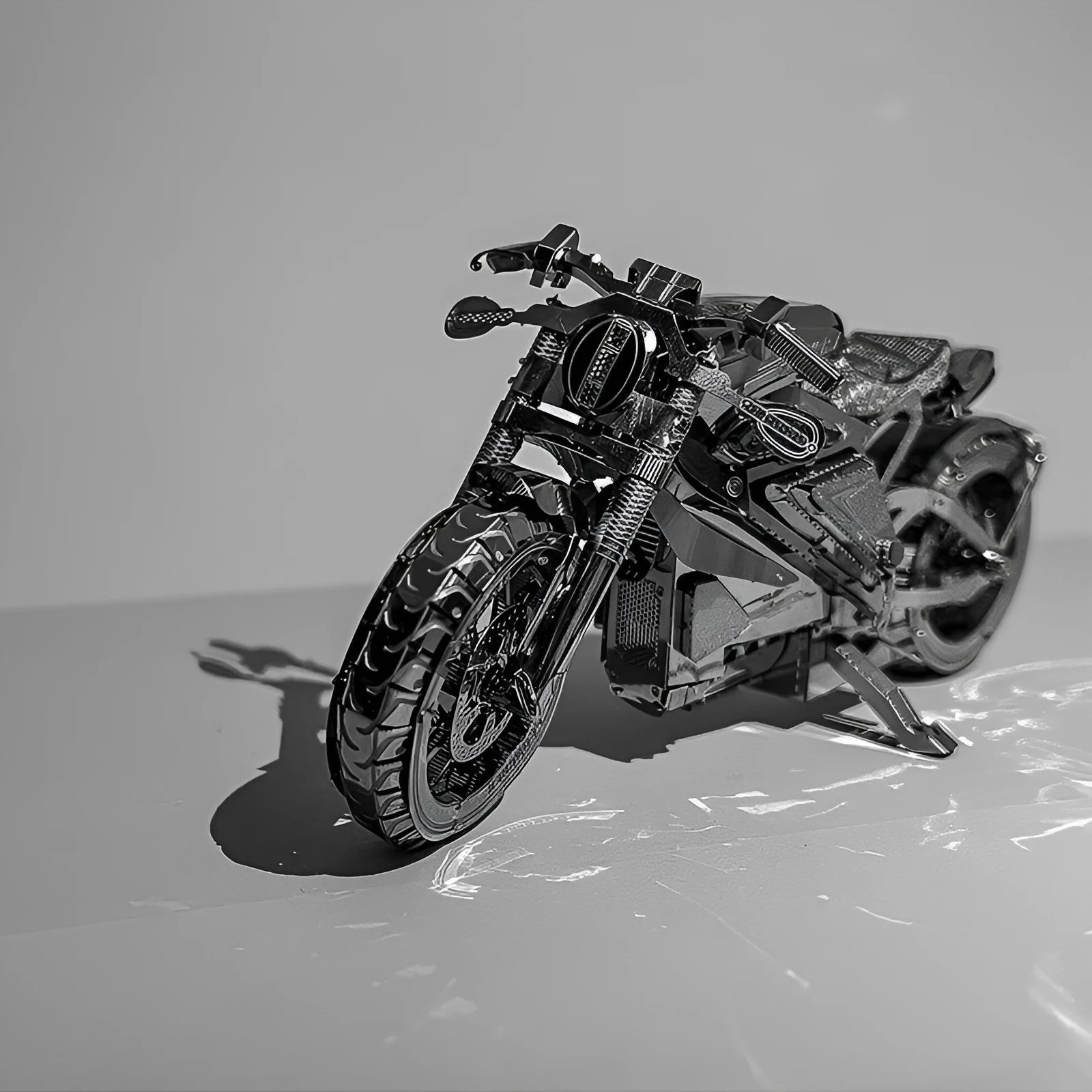 DIY 3D metal puzzle kit showing the Electric Toy Motorcycle model assembled on a table