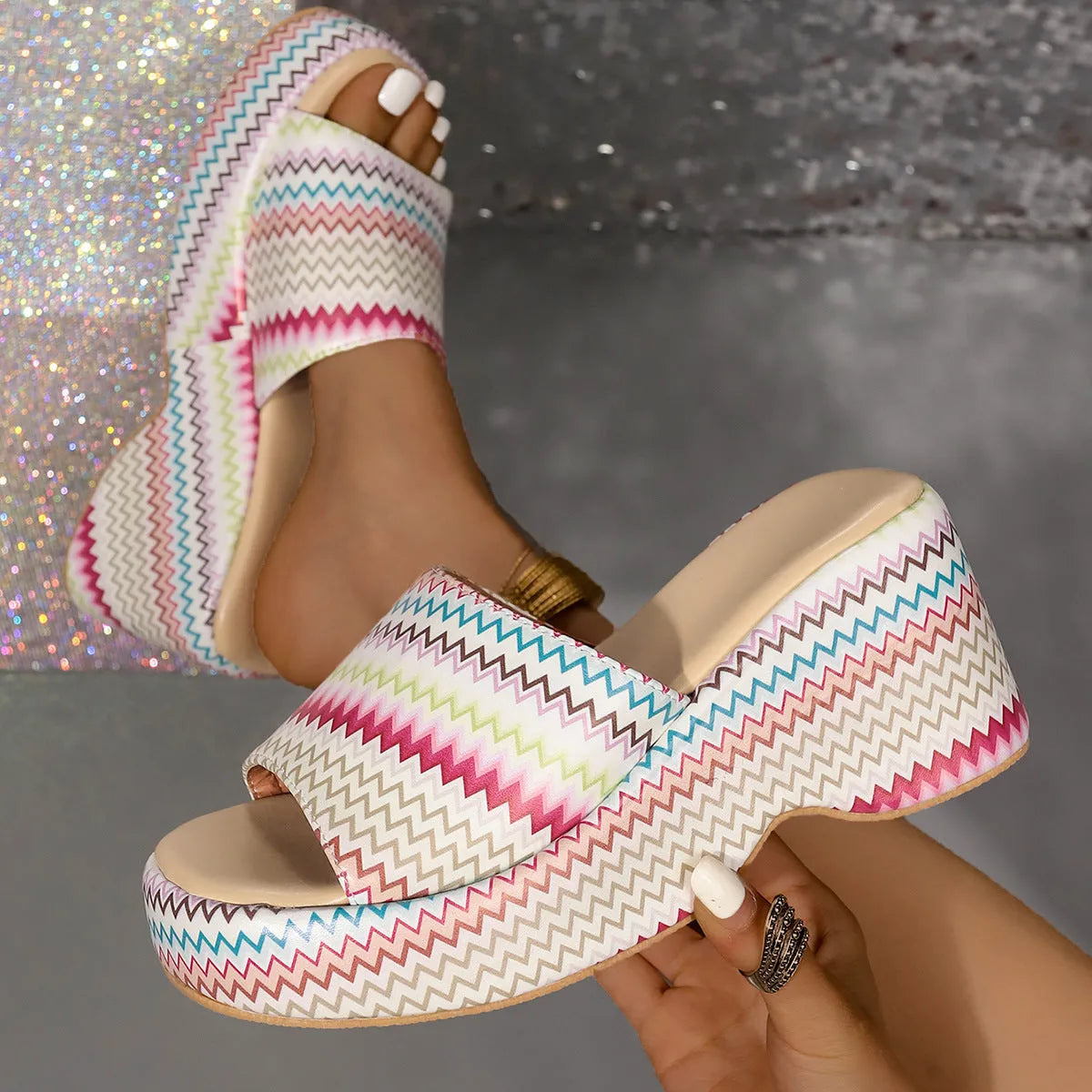 Colourful wave print wedge sandals for women on a beige background, showing fish mouth toe and thick sole.