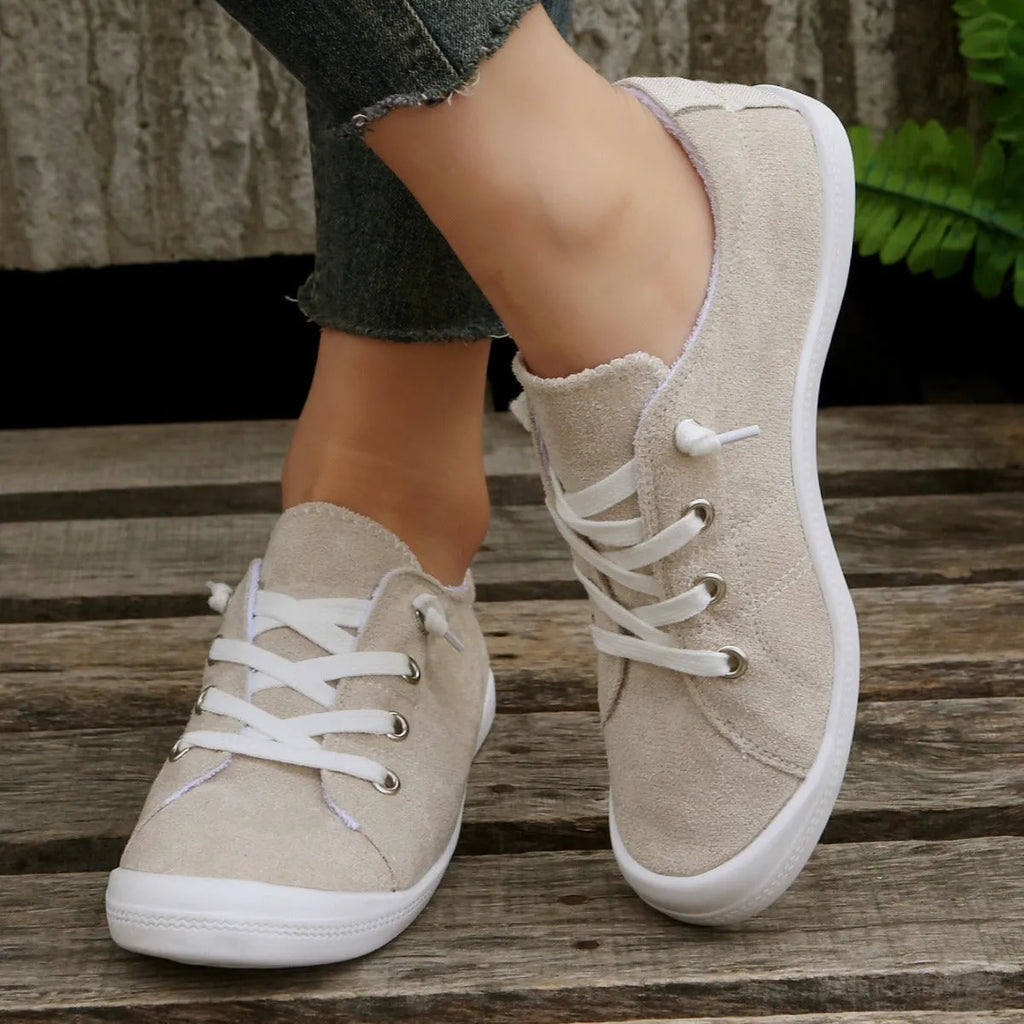 Women's creamy white casual sneakers with fabric upper and rubber sole