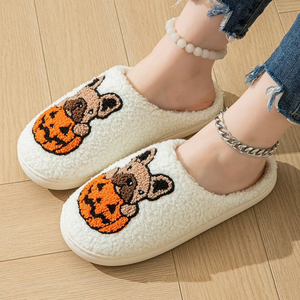 Black and white Halloween pumpkin plush slippers with TPR rubber soles in multiple sizes