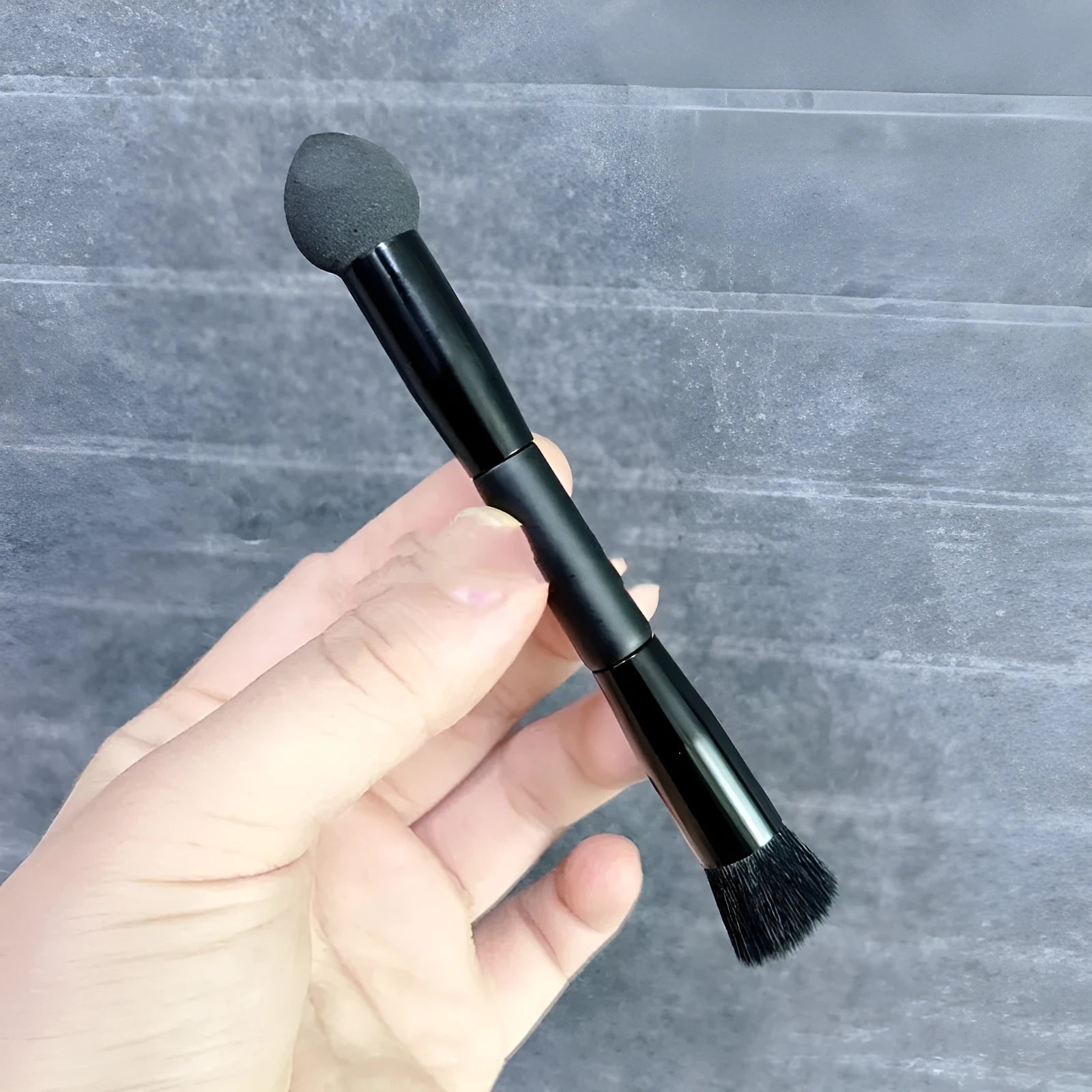 Black sponge concealer brush with wooden handle for dark circle coverage