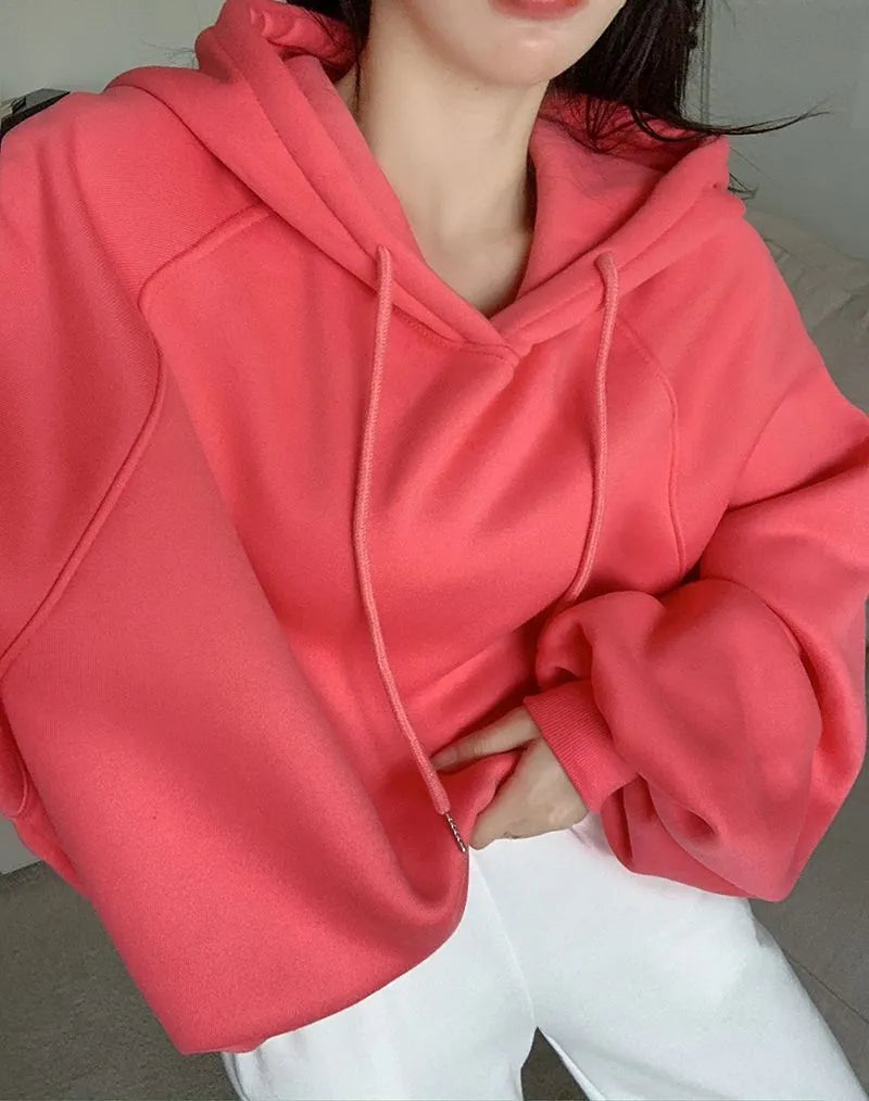 Watermelon red women's mulberry silk hooded sweater with sleeveless design on hanger