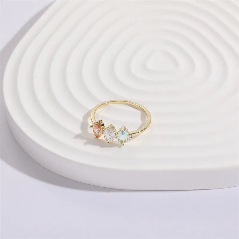 Geometric triangle birthstone ring with horse eye tricolour zircon in gold electroplated finish
