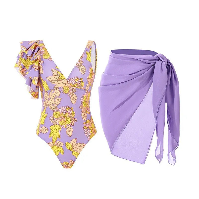Women's solid colour one-piece swimsuit with spaghetti straps and a matching removable skirt.