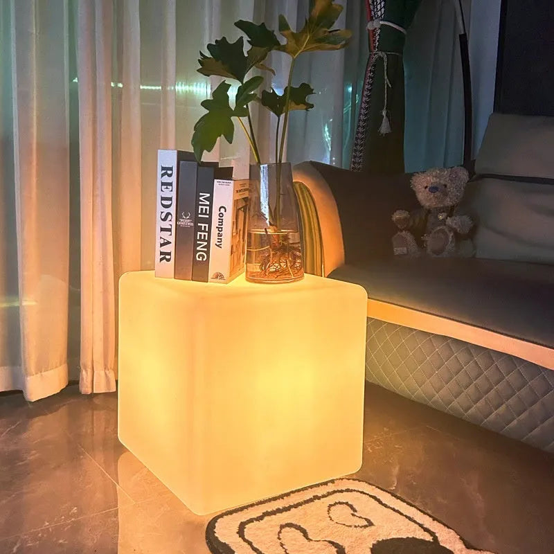 Modern square LED cube stool light for outdoor gardens, available in multiple sizes with solar or rechargeable power