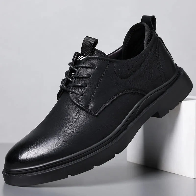 Men's black and brown leather shoes with sewn detailing and rubber sole