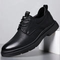 Men's black and brown leather shoes with sewn detailing and rubber sole