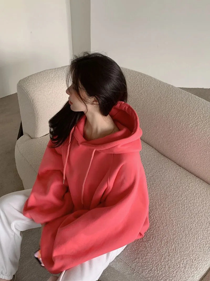 Watermelon red women's mulberry silk hooded sweater with sleeveless design on hanger
