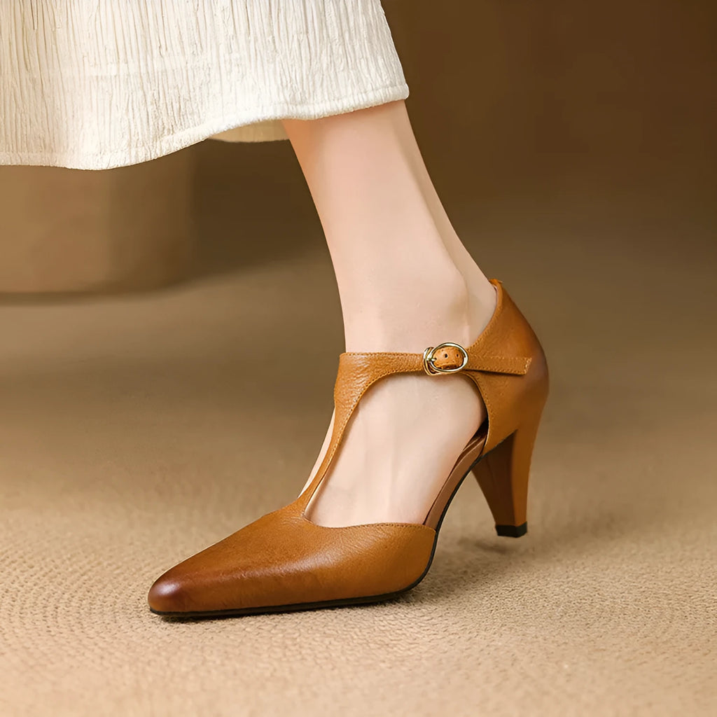 Brown retro women's T-strap closed-toe sandals with a 6-8cm heel on a wooden floor.