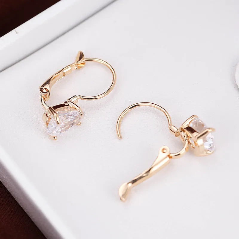 Women's drop-shaped copper earrings with metal inlays in gold and platinum colour options