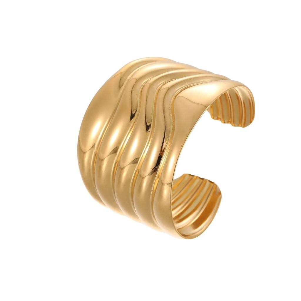Women's fashion bracelet with exaggerated wide design and geometric wave pattern in gold plating
