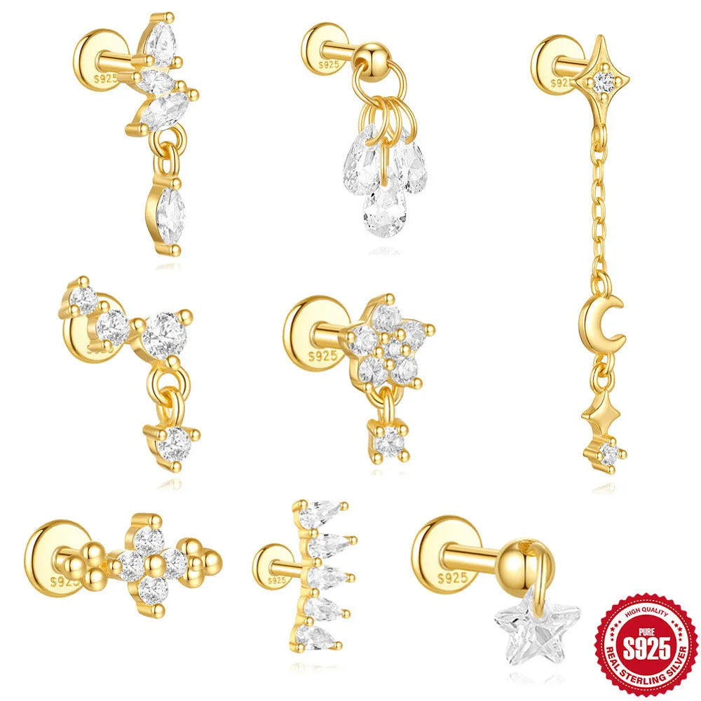 S925 sterling silver geometric moon and star earrings with embedded diamonds on a gold-coloured background.