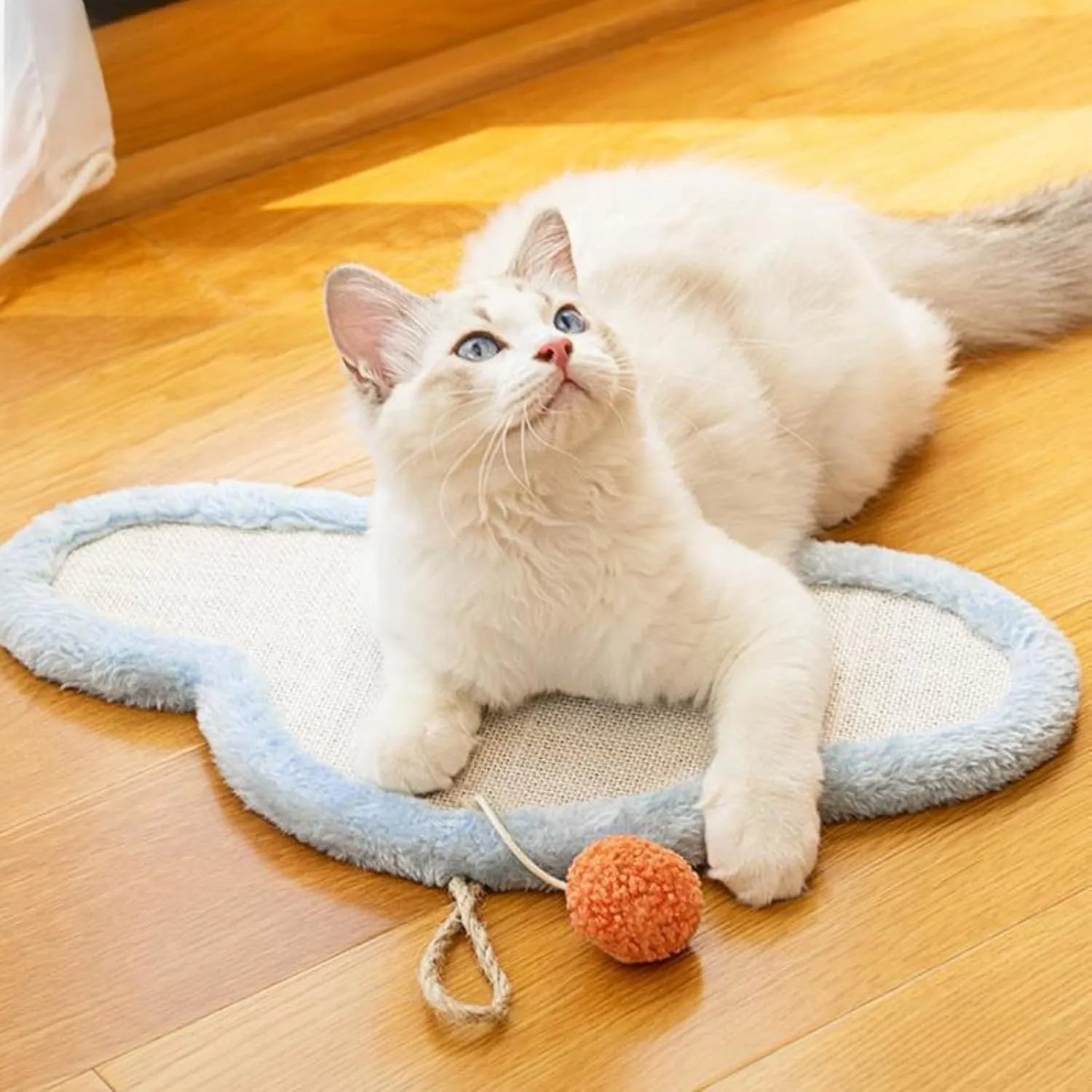 White cat scratching mat with cartoon sleeping cat design made from natural sisal