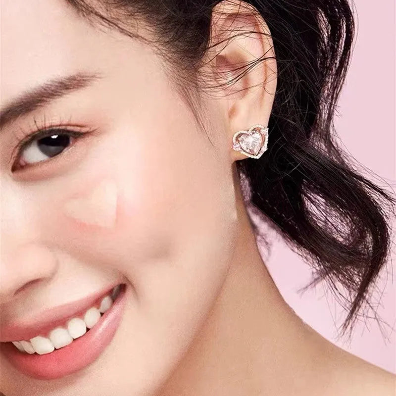 Guardian Heart white K stud earrings with heart shape design and butterfly backs.