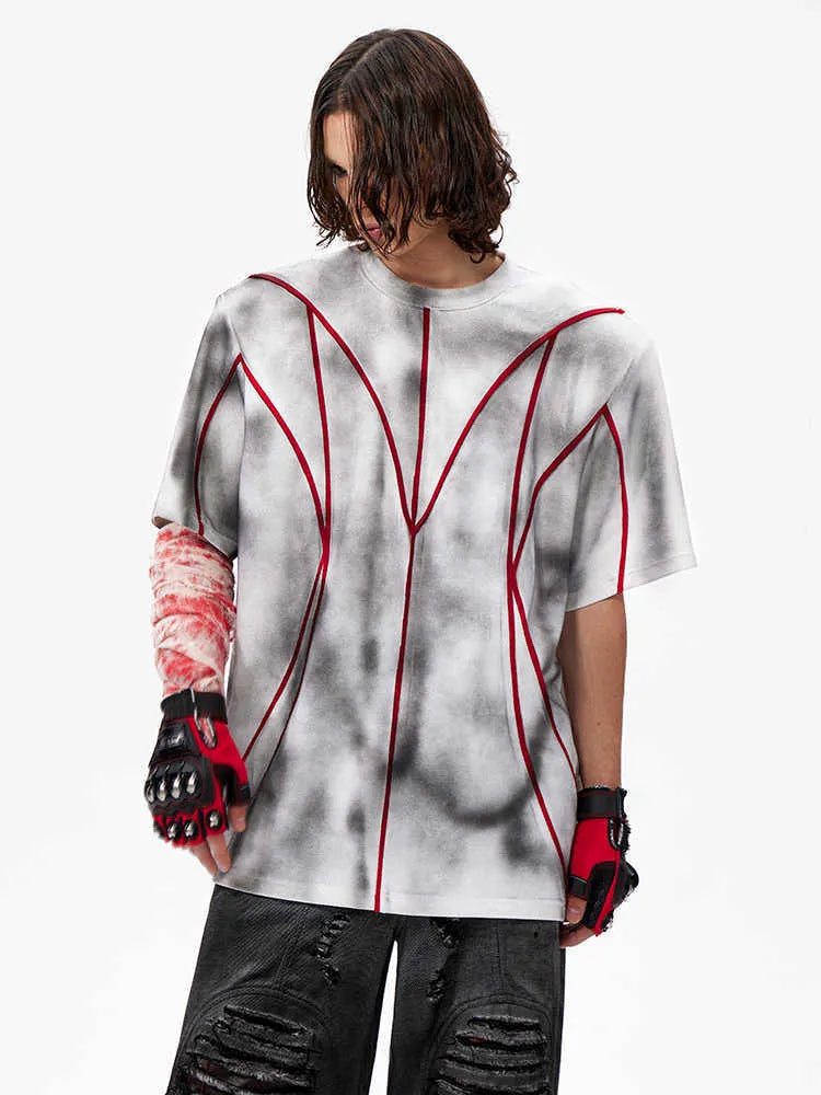 Women's grey padded shoulder t-shirt with 3D line patchwork design on front, short sleeves, round neck.