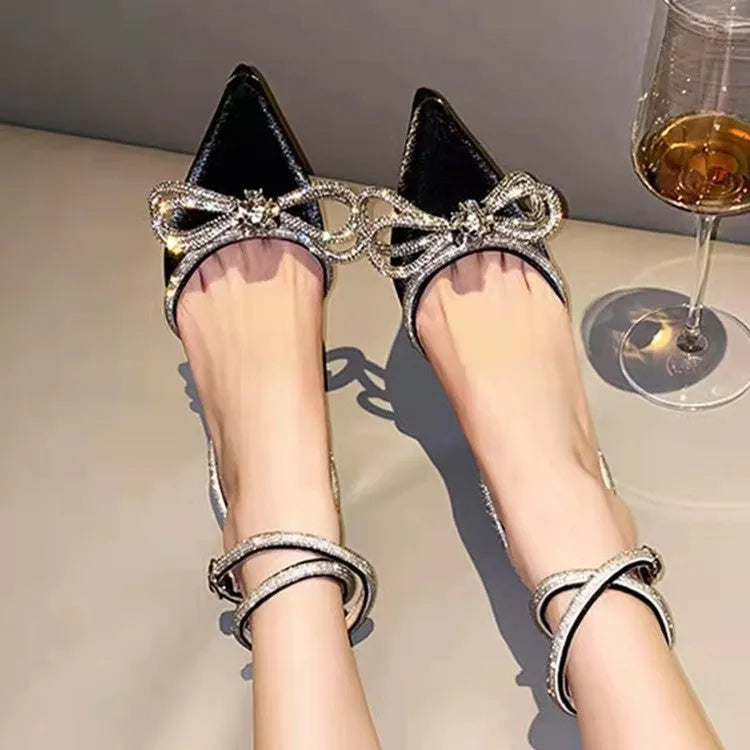 Women's stiletto heel sandals with a silk bandage back, buckle strap, and pointed toe in various colours.
