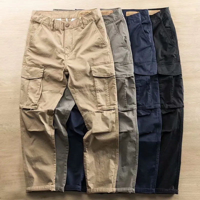 Men's solid colour cotton labour protection trousers in cropped length with multiple pockets, shown in khaki.